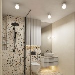 Biały kinkiet Zori 1xG9 IP44, zamontowany na ścianie w łazience, z okrągłym kloszem. Oświetlenie nad umywalką i w pobliżu lustra, w nowoczesnej aranżacji z terakotową ścianą i minimalistycznymi meblami.