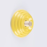 Kinkiet Zori 1xG9 IP44 w kolorze żółtym, o okrągłej, falistej podstawie. Widoczny gwint do żarówki G9 w centrum. Produkt zawieszony na białym tle, gotowy do montażu.