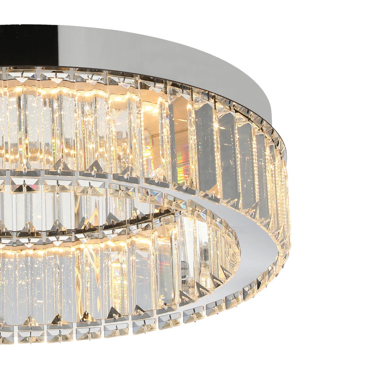 Lampa sufitowa LED Spark D40 o mocy 30W w kolorze chromu, z okrągłym metalowym korpusem i przezroczystymi, szklanymi elementami w kształcie kryształów, emitującymi ciepłe światło. Ujęcie z dołu, ukazujące detale wykończenia.