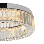 Lampa sufitowa LED Spark D40 o mocy 30W w kolorze chromu, z okrągłym metalowym korpusem i przezroczystymi, szklanymi elementami w kształcie kryształów, emitującymi ciepłe światło. Ujęcie z dołu, ukazujące detale wykończenia.