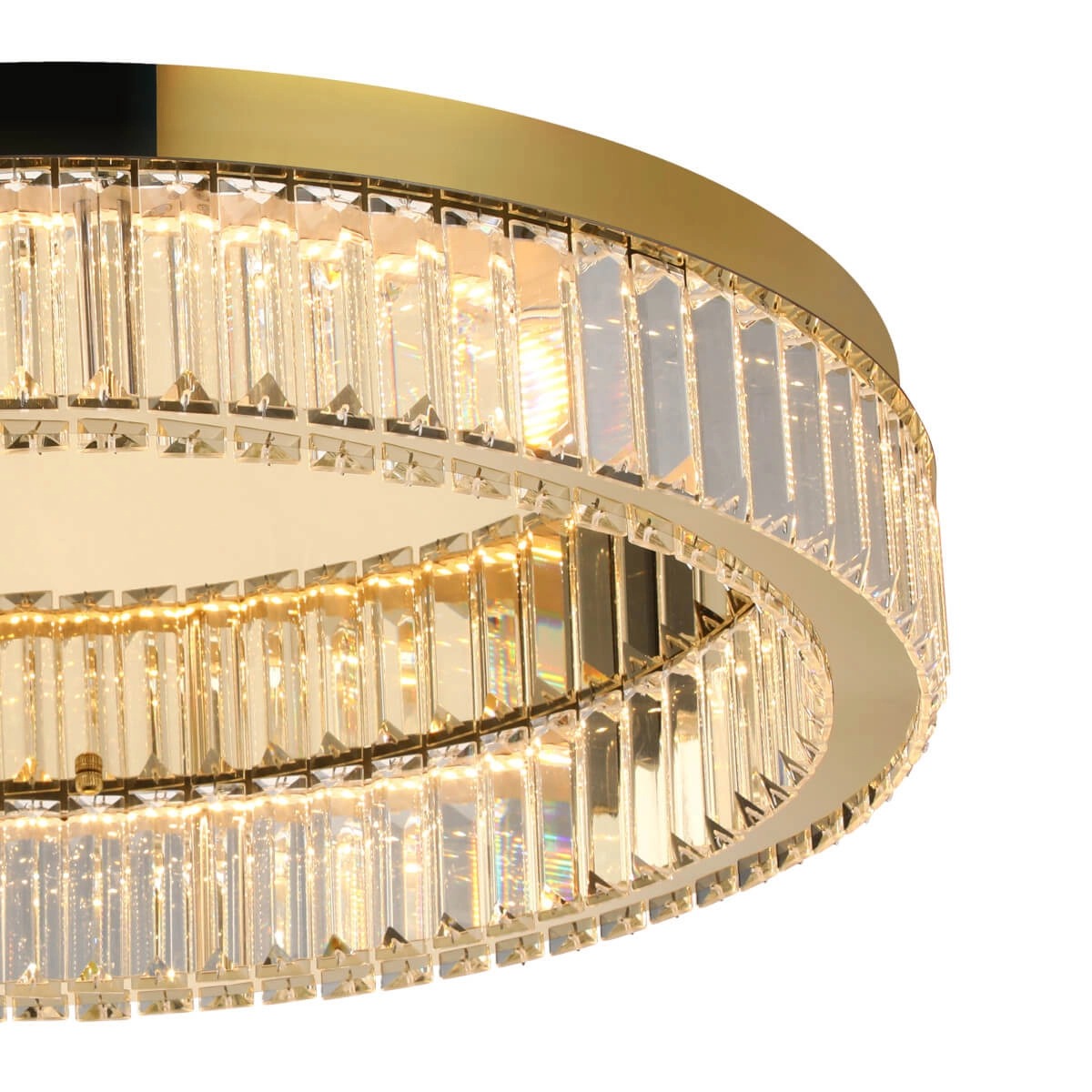 Lampa sufitowa LED Spark D60, 48W, w złotej obudowie. Okrągła konstrukcja z przezroczystymi, prostokątnymi elementami, emitującymi ciepłe światło. Widoczna lustrzana powierzchnia oraz eleganckie wykończenie podkreślają nowoczesny styl lampy.