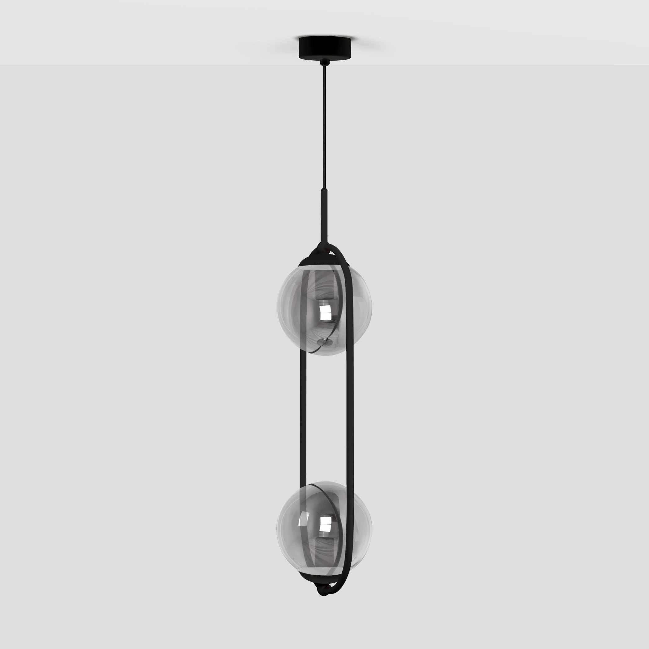 Lampa wisząca Davos z dwoma kulistymi kloszami, wykonana w kolorze czarnym i grafitowym. Zawieszona na cienkim przewodzie, z prostą, nowoczesną konstrukcją. Klosze przezroczyste, ukazujące źródło światła E14.