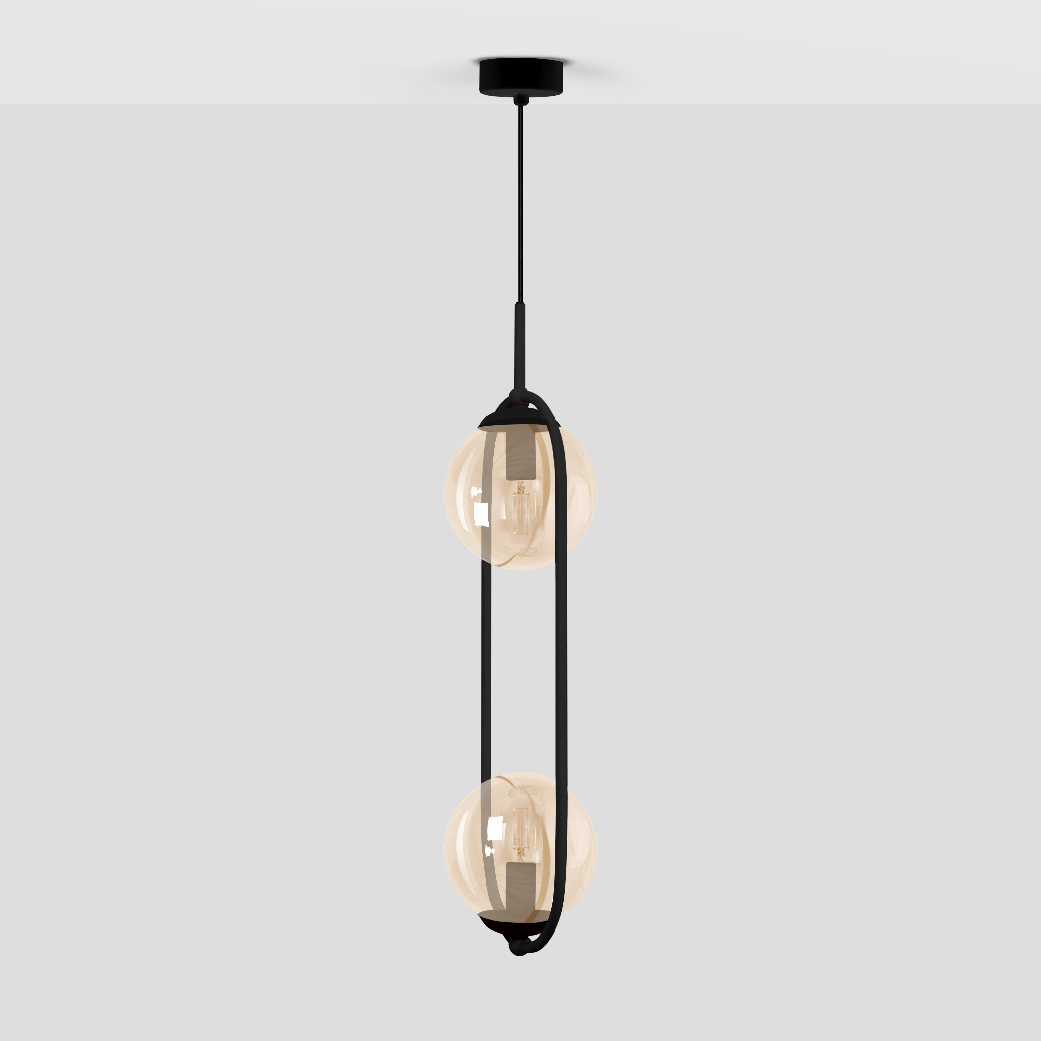 Lampa wisząca Venta K-5121 z dwoma szklanymi kulami w bursztynowym odcieniu, zawieszona na czarnym, prostym stelażu. Ujęcie z góry, ukazujące elegancki design i połączenie kolorów.