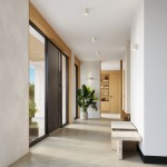 Beżowa lampa sufitowa Orbis Beton 1xGU10, montowana na suficie, z minimalistycznym designem. Widoczna w jasnym korytarzu, podkreślająca nowoczesne wnętrze z drewnianymi akcentami i rośliną w donicy.