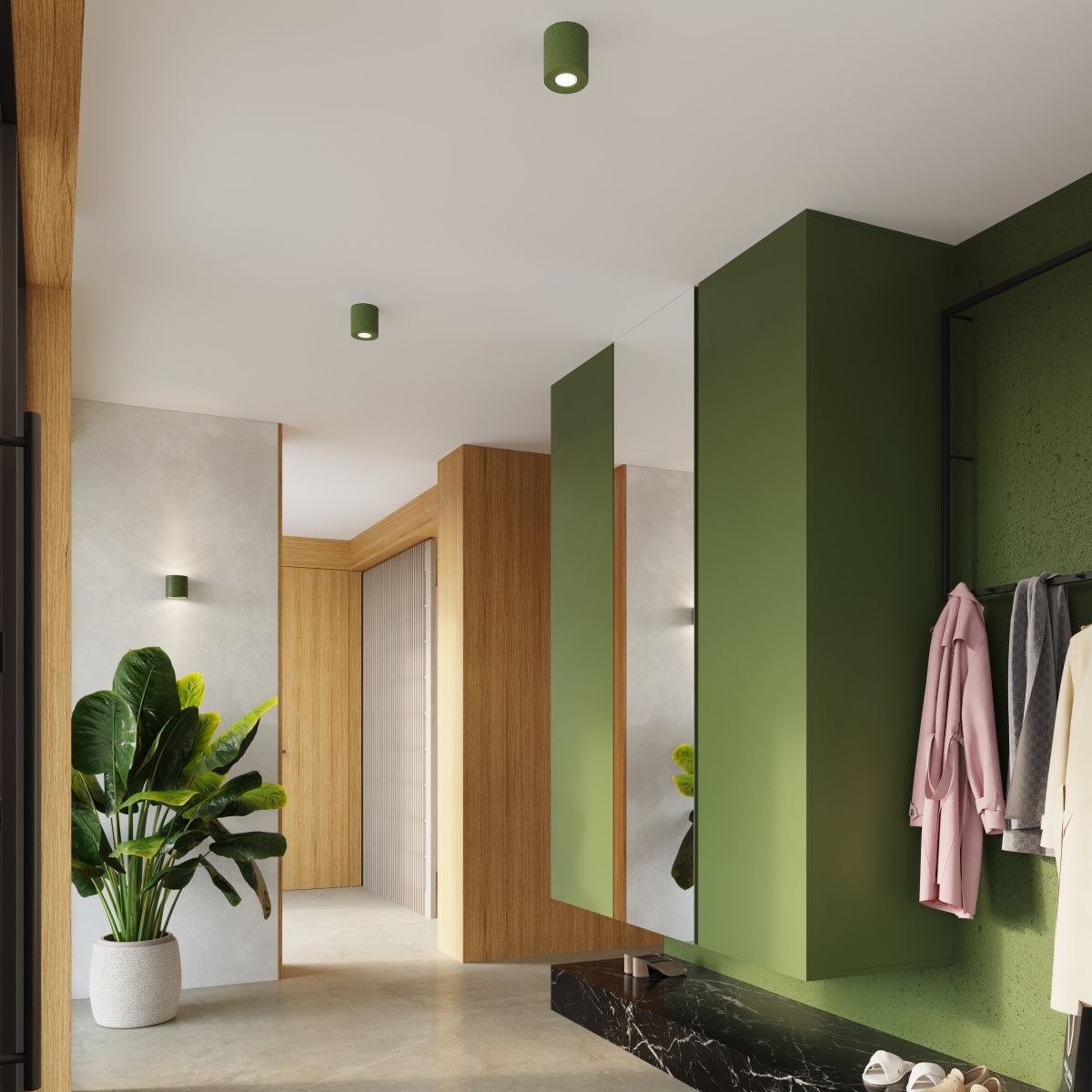 Lampa sufitowa Orbis Beton w kolorze zielonej oliwki z oprawą na jedną żarówkę GU10, zamontowana na suficie w nowoczesnym wnętrzu. W tle widoczna roślina oraz elementy drewniane i szare ściany, tworzące harmonijną aranżację.