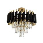 Lampa sufitowa Cristal 5xE14 w kolorze złotym, z czarnymi elementami. Okrągła konstrukcja z metalowymi prętami i wiszącymi kryształowymi dekoracjami. Ujęcie z dołu, ukazuje detale i strukturę lampy.