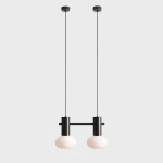 Lampa wisząca Flo Mokka z dwoma oprawami E14, w kolorze czarnym, z długimi przewodami. Okrągłe klosze z białego szkła, zawieszone na metalowej konstrukcji, w minimalistycznym stylu. Idealna do nowoczesnych wnętrz.