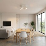 Lampa sufitowa Spoti SQ w kolorze białym z czterema reflektorami GU10, zamontowana na suficie w nowoczesnym wnętrzu. W tle widoczna jadalnia z drewnianym stołem i białymi krzesłami.