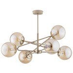 Beżowa lampa wisząca Sagito z sześcioma kloszami E14. Klosze w formie półkul, lekko przyciemniane, zamocowane na metalowej konstrukcji w kolorze beżowym. Lampa zawieszona na cienkim drążku, idealna do nowoczesnych wnętrz.