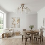 Lampa sufitowa Ariel 5xE27 w kolorze taupe z złotymi akcentami, z pięcioma kloszami w kształcie dzwonu, zamontowana na okrągłej podstawie. Widoczne w nowoczesnej aranżacji wnętrza z drewnianym stołem i jasnymi meblami.