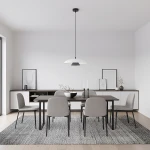 Lampa wisząca Babel 1xGX53 w kolorze czarnym i białym, zawieszona na długim kablu, umieszczona nad prostokątnym stołem w jasnej jadalni. W tle widoczne szare krzesła, minimalistyczne dekoracje i neutralne ściany.