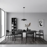 Lampa wisząca Babel 1xGX53 w kolorze czarnym, umieszczona nad stołem w nowoczesnej jadalni. Produkt ma okrągły klosz i długie zawieszenie, w otoczeniu szarego stołu i krzeseł oraz minimalistycznej półki z książkami.