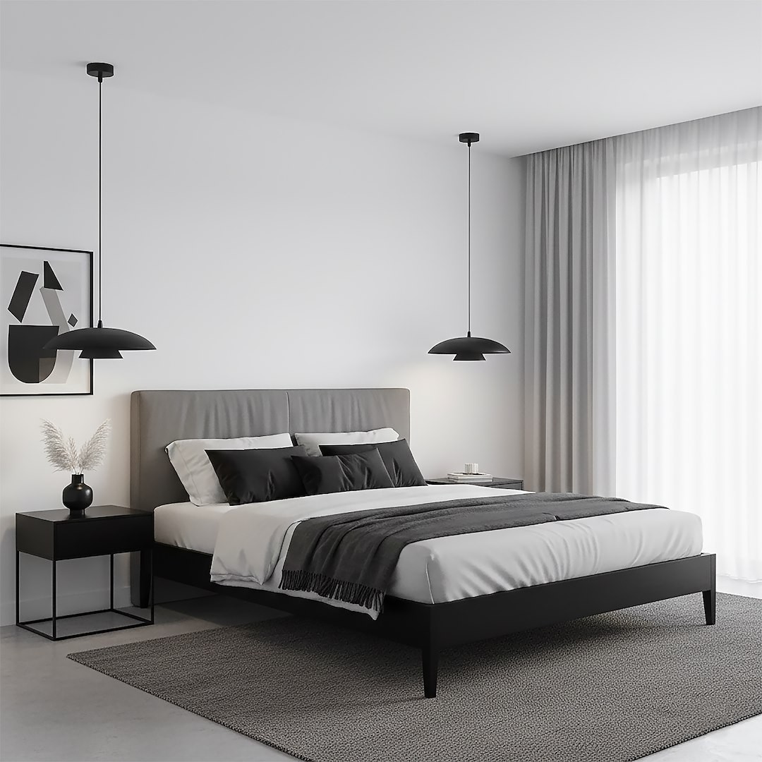 Lampa wisząca Babel 1xGX53 w kolorze czarnym, zawieszona nad łóżkiem w nowoczesnej sypialni. Ujęcie frontalne, z widocznymi detalami lampy oraz otoczeniem, w tym szarej pościeli i minimalistycznym stoliku nocnym.