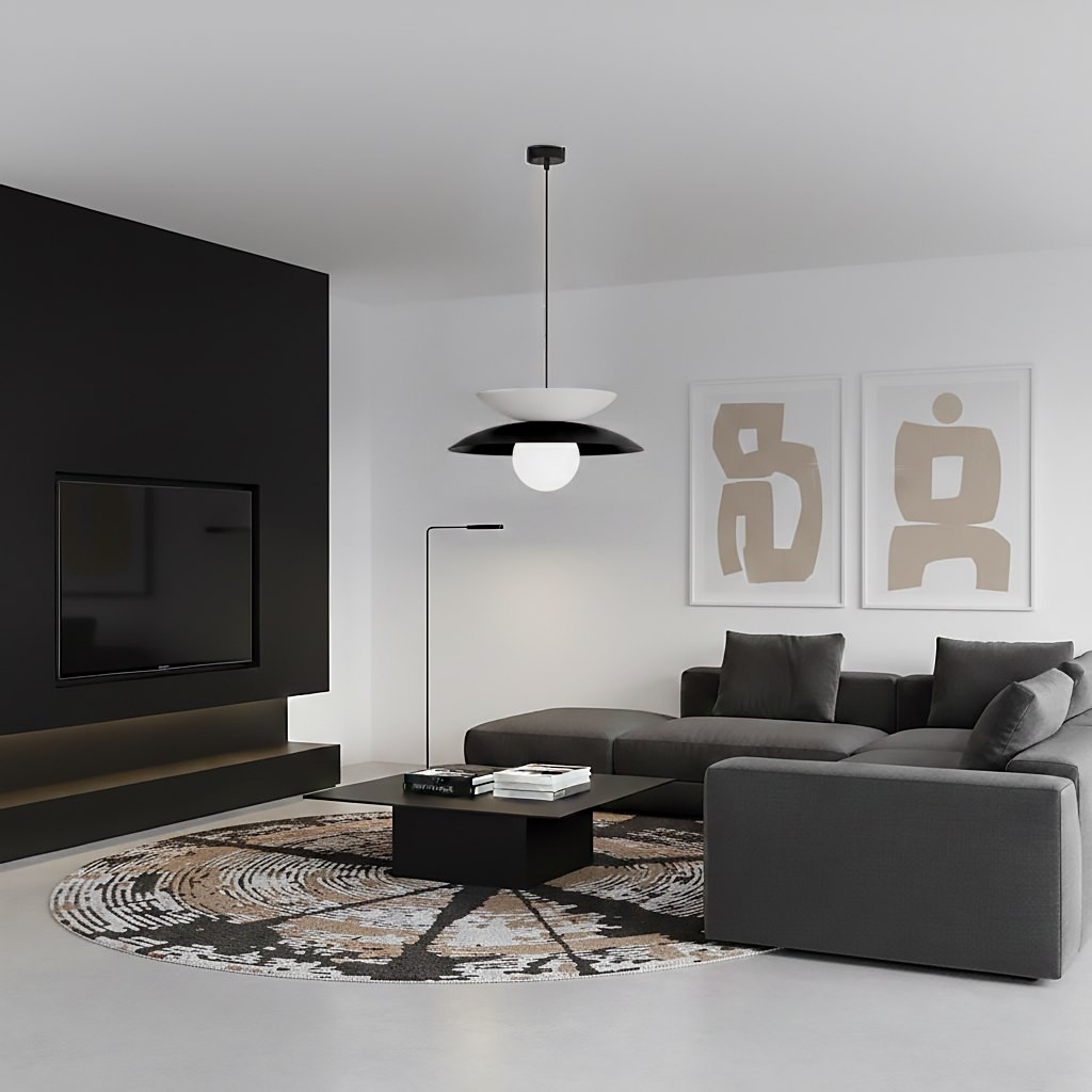 Lampa wisząca Nagoya 1xG9 w kolorze czarnym i białym, zawieszona na cienkim kablu, w nowoczesnym wnętrzu z szaro-czarną sofą i okrągłym dywanem. Obok widoczny stół kawowy z książkami i lampa stojąca.