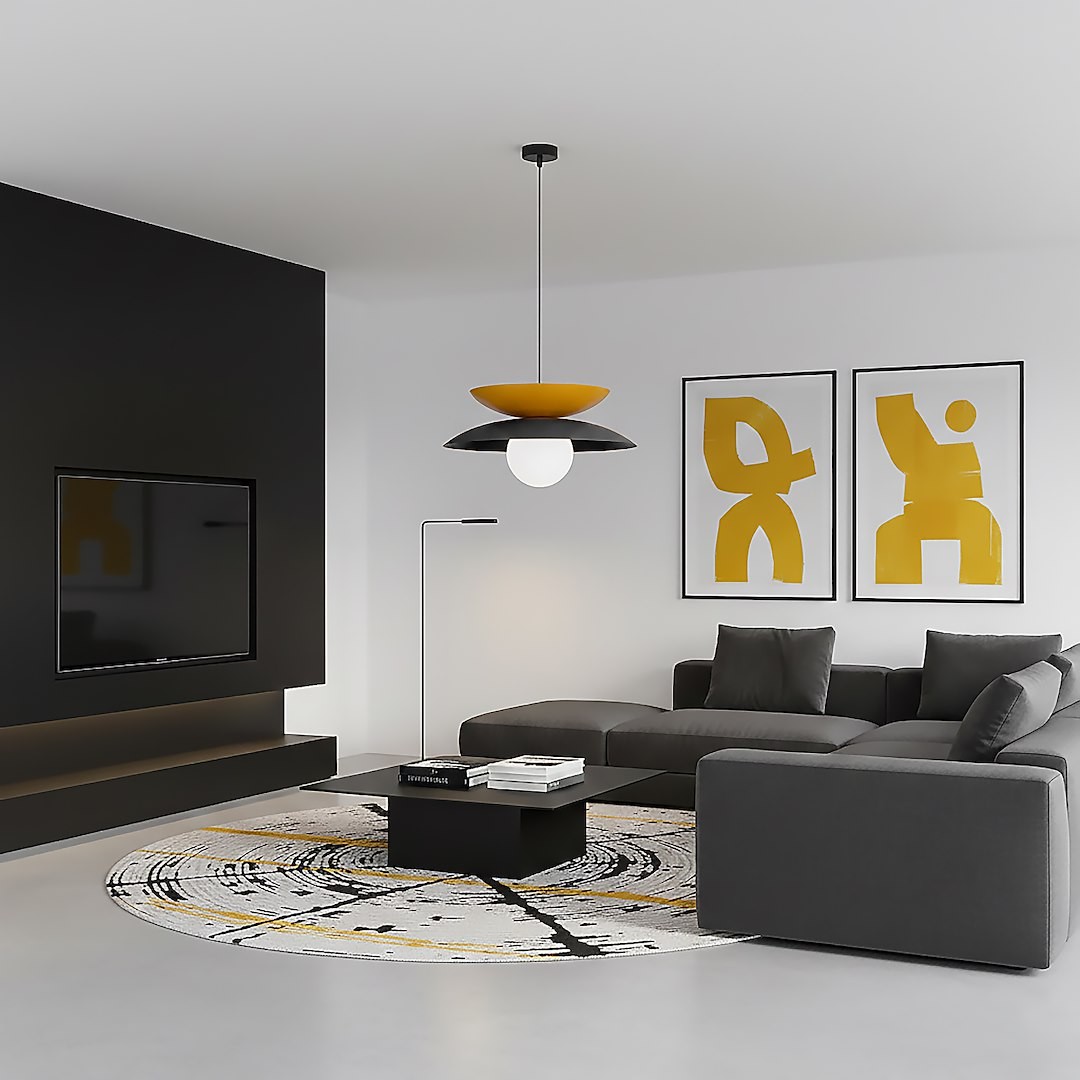 Lampa wisząca Nagoya 1xG9 w czarno-pomarańczowej kolorystyce, z okrągłą, białą żarówką. Zawieszona na czarnym przewodzie w minimalistycznym wnętrzu z szarym narożnikiem, czarnym stolikiem i dekoracyjnymi obrazami na ścianie.