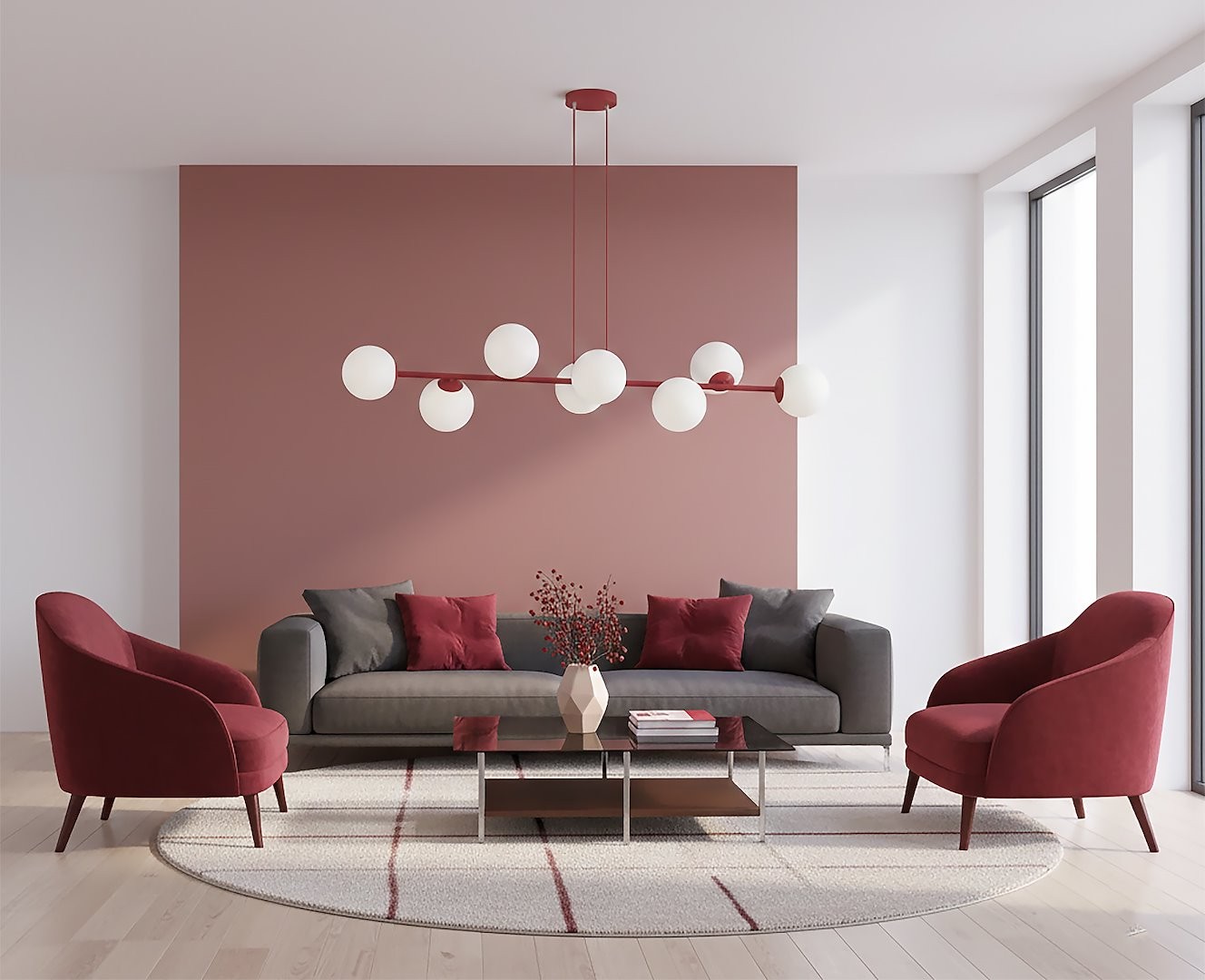 Lampa wisząca Magnus 8xE14 w kolorze burgundowym i białym, zawieszona w nowoczesnym wnętrzu. Posiada osiem okrągłych kloszy, umieszczonych na cienkiej, czerwonej konstrukcji. W tle widoczny stylowy zestaw mebli w odcieniach burgunda i szarości.