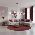 Lampa wisząca Magnus w kolorze burgundowym i białym, z ośmioma kulistymi kloszami E14, zawieszona nad szarym narożnikiem w nowoczesnym salonie z akcentami w odcieniach czerwieni. Tło z dekoracyjnymi ścianami i zasłonami.
