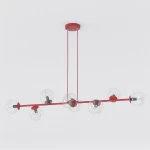 Lampa wisząca Magnus w kolorze burgundowym z transparentnymi kloszami, posiadająca osiem gniazd E14. Produkt zawieszony na dwóch cienkich linkach, z okrągłym stelażem przymocowanym do sufitu. Klosze w kształcie kul, zapewniające nowoczesny wygląd.