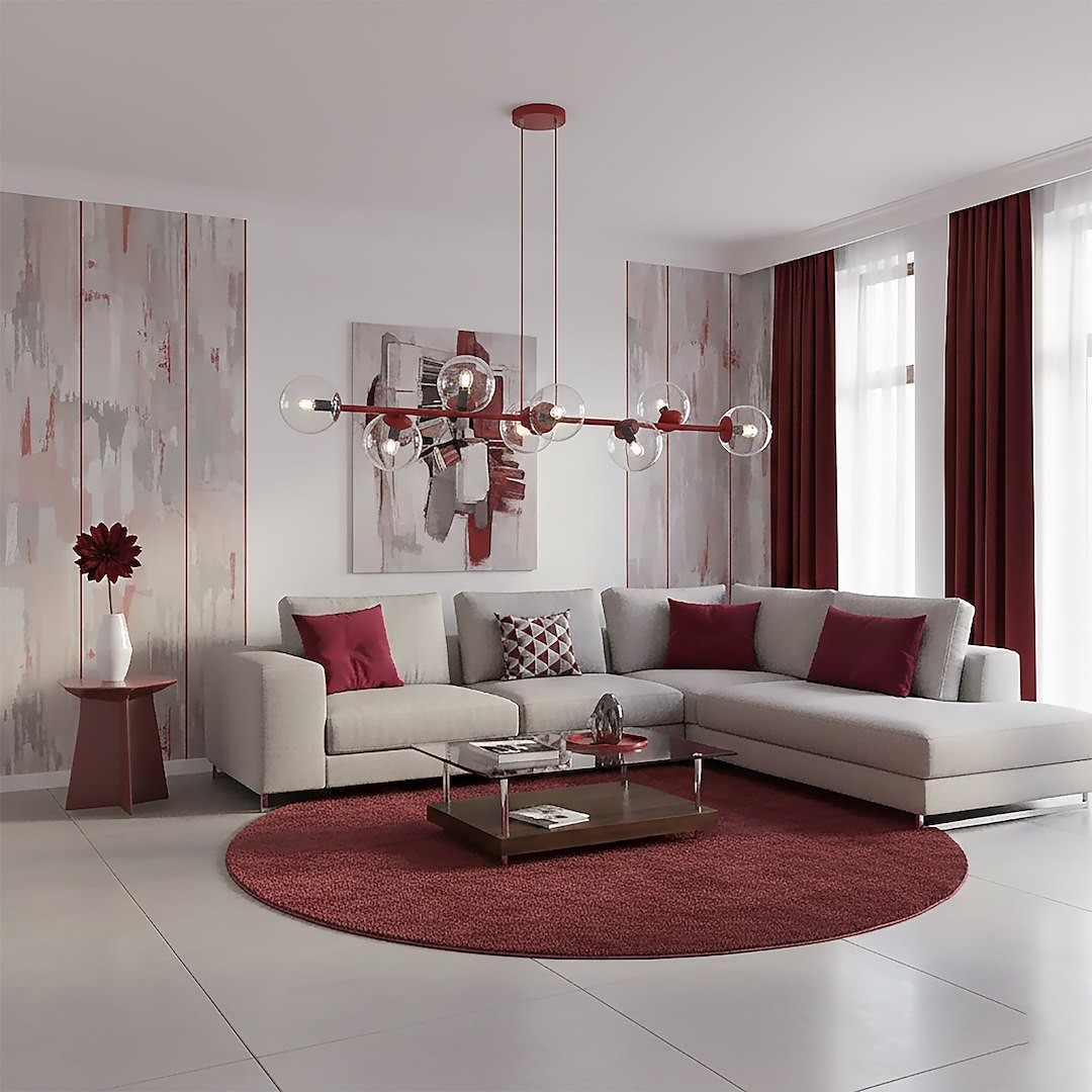 Lampa wisząca Magnus 8xE14 w kolorze burgundowym z przezroczystymi kloszami, zawieszona nad szaro-beżową sofą w salonie. W tle widoczne czerwone zasłony oraz dekoracje na ścianach. Zestawiony z okrągłym dywanem i stolikiem kawowym.