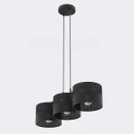 Lampa wisząca Karbon 3xE27 w kolorze czarnym z trzema cylindrycznymi kloszami o perforowanej fakturze. Ułożona w pionie, zawieszona na cienkich linkach, idealna do nowoczesnych wnętrz. Montowana na suficie, z widocznymi żarówkami.