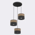 Lampa wisząca Karbon 3xE27 w kolorze czarnym i brązowym. Trzy cylindryczne klosze z materiału, z perforowanym wzorem, zawieszone na czarnych linkach. Urokliwy design, idealna do nowoczesnych wnętrz.