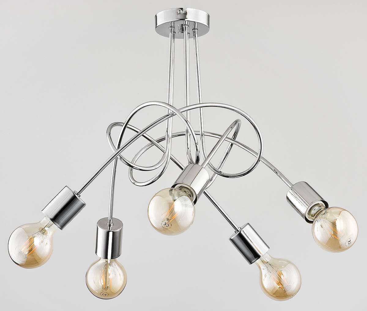 Lampa wisząca Tango 5-punktowa w kolorze chromu. Posiada pięć żarówek w przezroczystych oprawach, z elastycznymi, metalowymi ramionami, które tworzą dynamiczny układ. Montaż sufitowy, zdjęcie z góry.