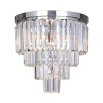 Lampa sufitowa Amedeo 5-punktowa w chromowanym wykończeniu, z kryształowymi elementami w formie prostokątnych, transparentnych pryzmatów. Ułożona w poziomie, z efektownym detalem w dolnej części, emituje jasne światło.