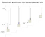 Oprawa schodowa Oti LED 12V z czujnikiem ruchu, barwa ciepła 3000K. Ujęcie z przodu, ukazujące obudowę w kolorze białym, prostokątny kształt, z wyraźnym otworem czujnika. Widoczne przewody zasilające. Produkt montowany na schodach.