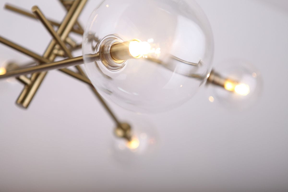 Lampa wisząca Lollipop 6-punktowa, z metalową konstrukcją w kolorze złotym. Widoczne przezroczyste klosze z żarówkami w środku, w ujęciu z góry, podkreślające nowoczesny design i symetryczny kształt.