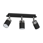 Trzypunktowa lampa sufitowa Joker w kolorze czarnym, z metalowymi detalami w odcieniu srebrnym. Zamontowana na prostokątnej, czarnej podstawie, z regulowanymi reflektorami w formie cylindrów. Idealna do nowoczesnych wnętrz.