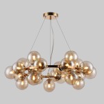 Lampa wisząca Cabella 25-punktowa w kolorze koniakowym, z przezroczystymi szklanymi kulami, zawieszona na cienkich linkach. Metalowa konstrukcja z błyszczącym wykończeniem. Kule rozmieszczone równomiernie, tworzą efektowną kompozycję.