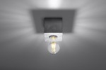 Lampa sufitowa Ariz Beton 1-punktowa SL.0681 z betonowym kloszem w kolorze szarym, z widoczną żarówką w stylu retro. Ujęcie frontalne, montaż sufitowy, minimalistyczny design, emitujący ciepłe światło na tle jasnej powierzchni.