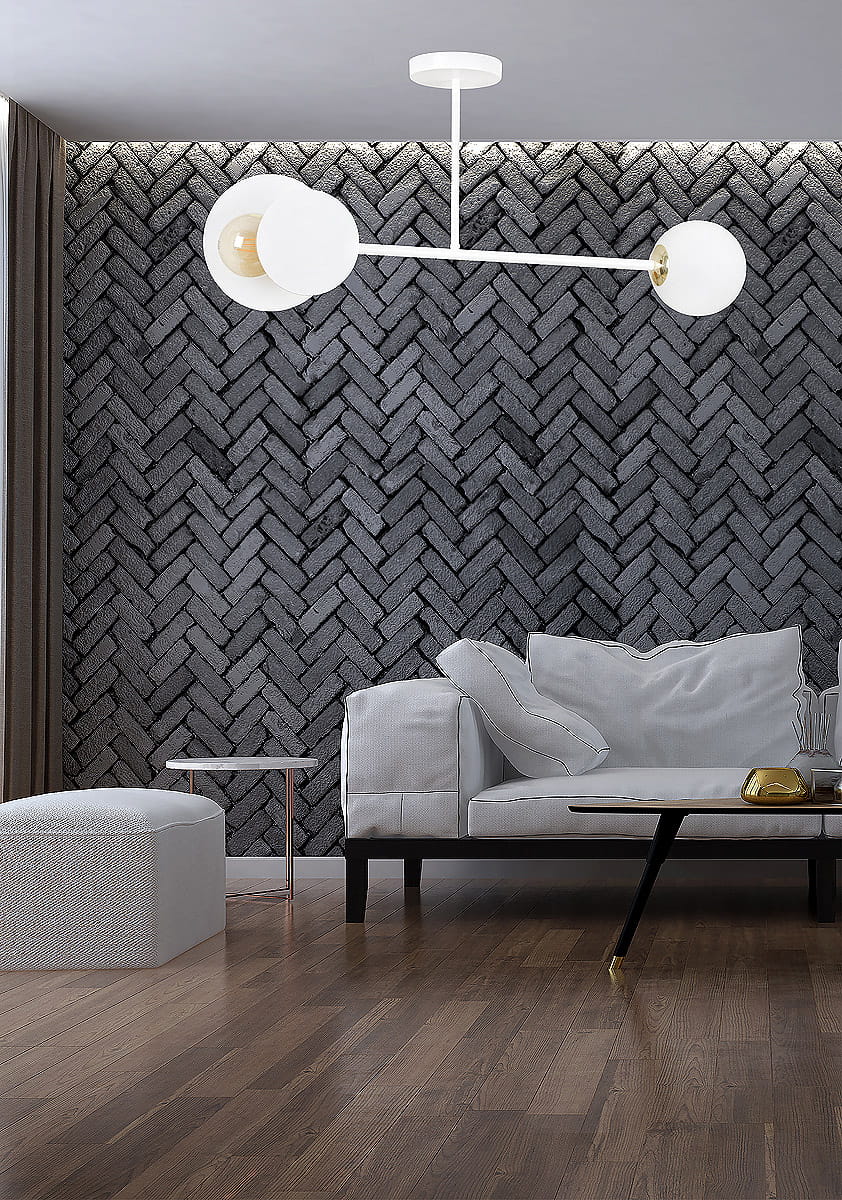 Biała lampa sufitowa Minerva 2-punktowa z okrągłymi kloszami, umieszczona na prostym, metalowym stelażu. Ujęcie z dołu, lampa zawieszona w nowoczesnym wnętrzu z ciemną, teksturowaną ścianą i jasnym meblem.