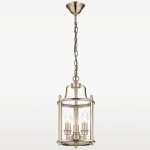 Lampa wisząca New York, 3-punktowa, w kolorze złotym. Szklana obudowa z metalowym stelażem, z trzema żarówkami w kształcie łzy. Ujęcie frontalne, zawieszona na łańcuchu, idealna do nowoczesnych wnętrz.
