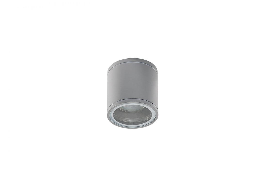 Lampa sufitowa elewacyjna Joe Tube, 1-punktowa w jasnoszarym kolorze. Okrągły kształt, metalowa obudowa z przezroczystą soczewką na dole. Zawieszona w pozycji pionowej, idealna do oświetlenia zewnętrznego.