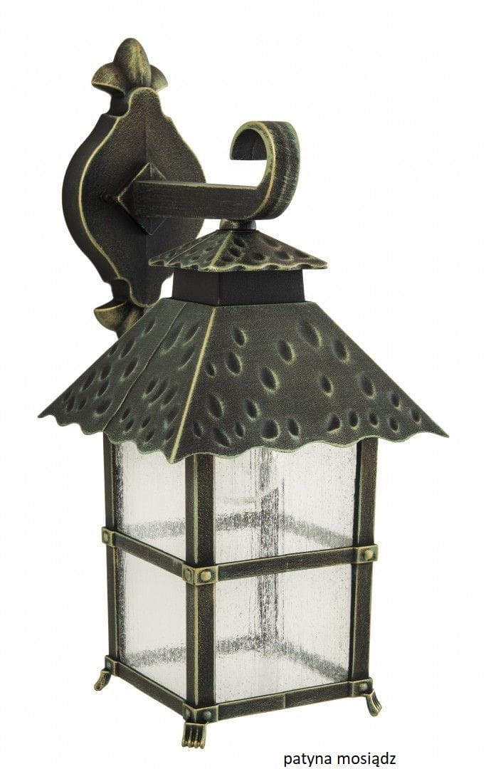 Kinkiet elewacyjny Cadiz w kolorze czarnym, z ozdobnym, spiczastym dachem i patynowanymi detalami. Wykonany z metalu, z przezroczystymi, teksturowanymi szybami. Montowany na ścianie, z wystającym uchwytem. Wymiary nieokreślone.