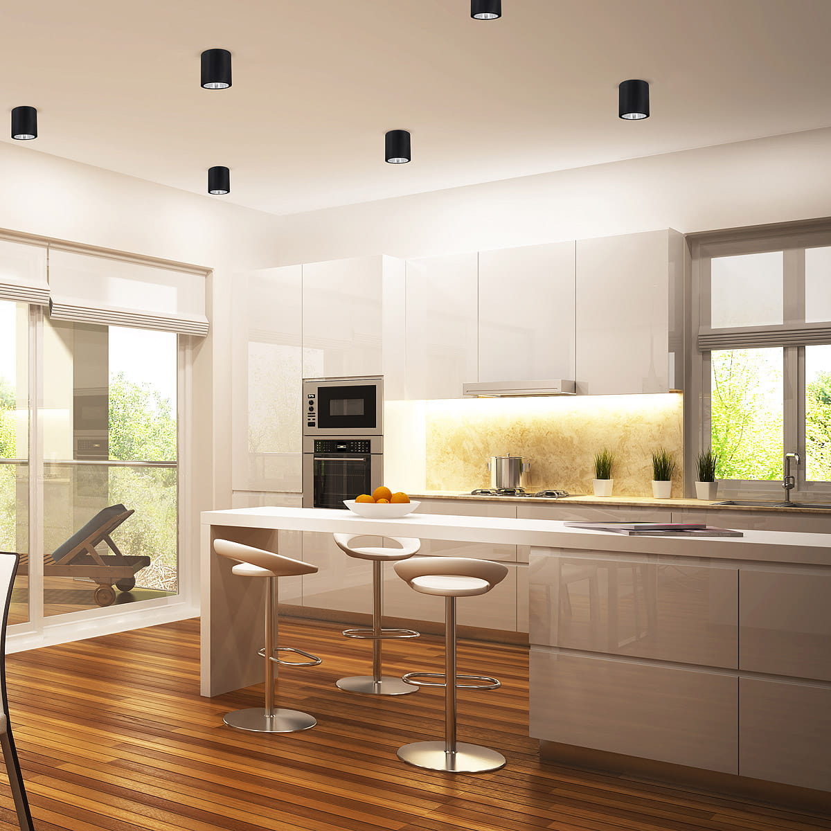 Lampa sufitowa natynkowa Jupiter 10 w kolorze czarnym, z jedną oprawą E27, zamontowana w nowoczesnej kuchni. Widoczna w tłem białe meble, drewniana podłoga i okna, przez które wpada naturalne światło.