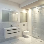 Kinkiet Shine LED IP44 w kolorze białym, montowany na ścianie, o długości 60 cm i mocy 13,8W. Umieszczony nad lustrem w nowoczesnej łazience, z prostym, minimalistycznym designem. Oświetlenie w jasnym otoczeniu z szarymi płytkami.