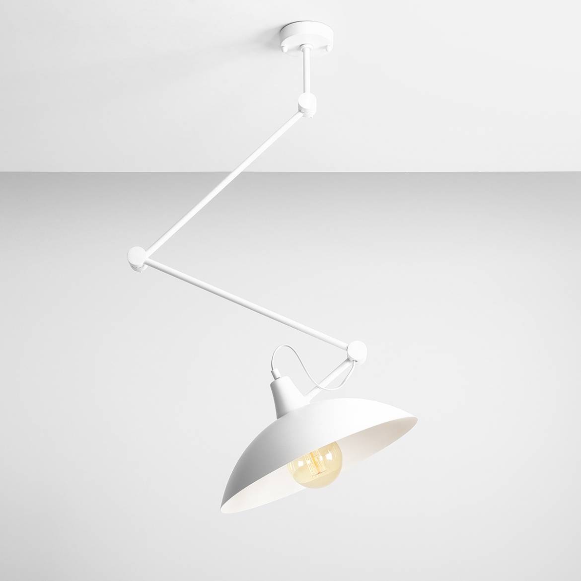 Lampa wisząca Melos 1-punktowa w kolorze białym, z metalowym kloszem w kształcie stożka. Ujęcie z góry, zawieszona na białym przewodzie. Widoczna żarówka w środku. Prosta konstrukcja, minimalistyczny design, idealna do nowoczesnych wnętrz.