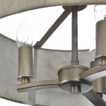 Lampa wisząca Venera 3-punktowa, kolor metaliczny, z przezroczystymi żarówkami w kształcie łzy. Ujęcie z bliska, ukazujące metalową konstrukcję i detal mocowania. Elementy zdobnicze w formie prostych linii, rozłożone równomiernie.