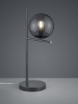 Lampa stołowa Pure 1-punktowa w kolorze antracytowym. Posiada okrągły klosz z ciemnego szkła oraz prostą, metalową podstawę. Ujęcie frontalne, lampa stoi na płaskiej powierzchni, z widocznym przewodem.
