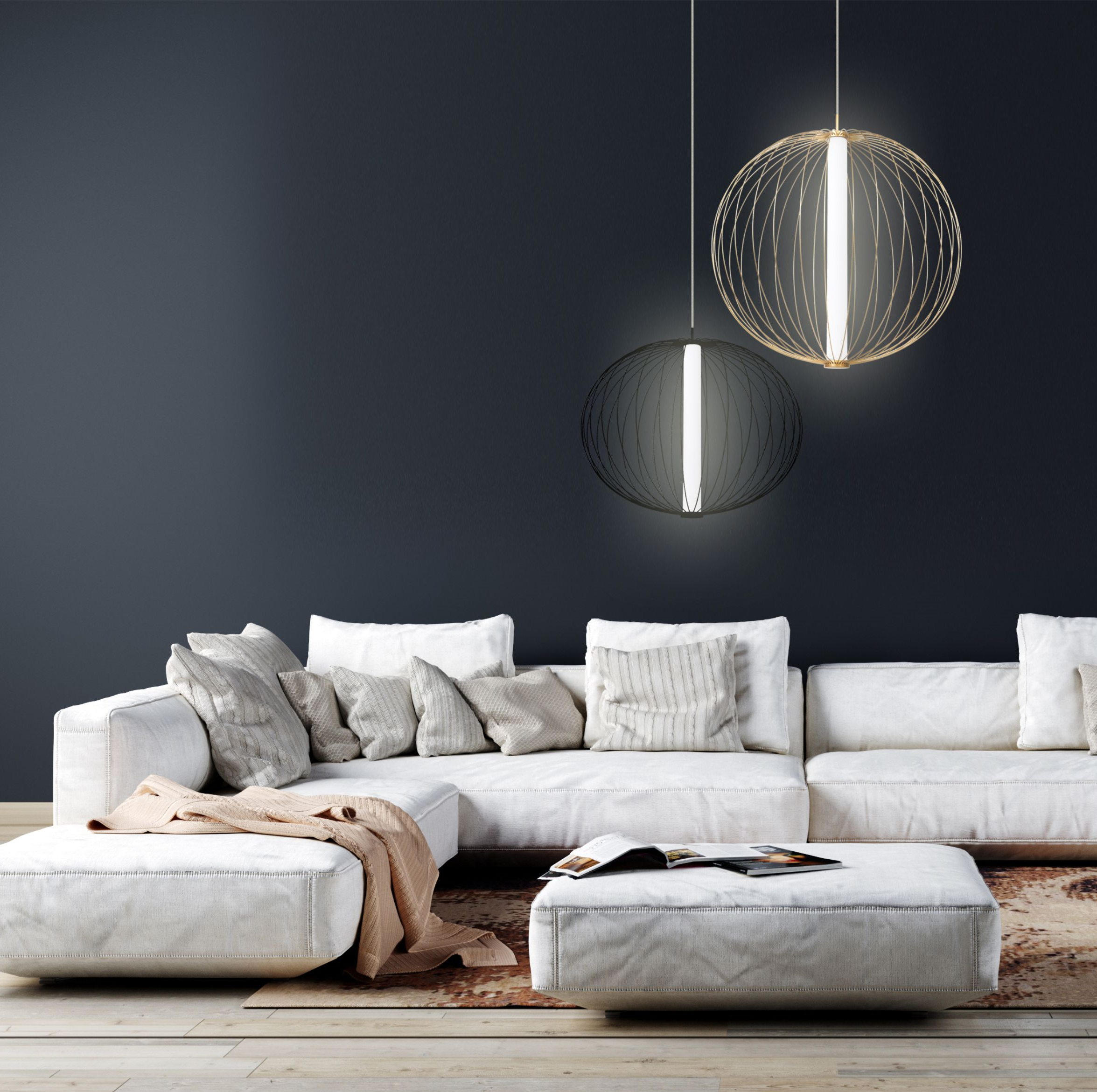Czarna lampa wisząca Treviso LED D40 o jednolitym kształcie, z delikatnym źródłem światła, zawieszona nad białą sofą. Lampa emituje światło o temperaturze barwowej 4000K, tworząc nowoczesny akcent w aranżacji wnętrza.