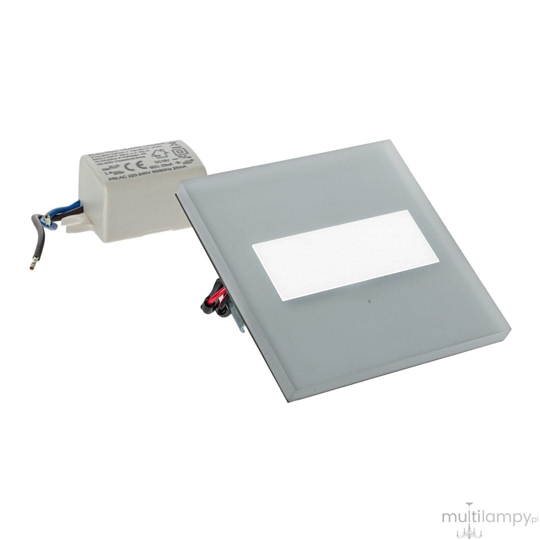 Oprawa schodowa Lumi White LED 230V w kolorze szarym. Płaska konstrukcja z matowym kloszem i białym, prostokątnym panelem świetlnym. Widoczny zasilacz podłączony do oprawy. Barwa światła ciepła 3000K, idealna do oświetlenia schodów.