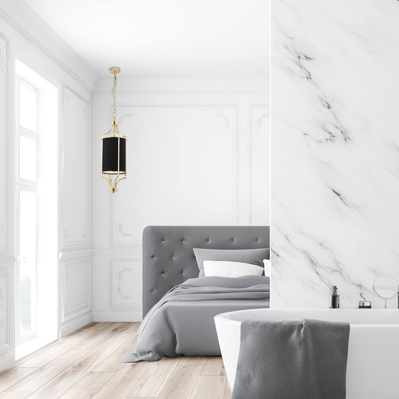 Lampa wisząca Lunga Gold Nero w kolorze złotym i czarnym, zawieszona w jasnym wnętrzu sypialni. Okrągła, czarna abażur z metalową, złotą oprawą, wisząca na delikatnym łańcuchu. W tle widoczny szary zagłówek łóżka oraz biały, wolnostojący wanien.