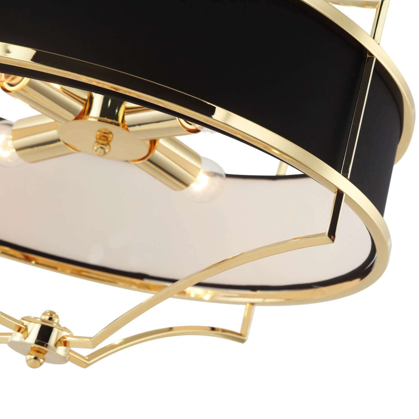 Lampa wisząca Stesso Gold Nero M, czarna z złotymi detalami, z czterema punktami świetlnymi. Widok z góry, ukazujący metalową konstrukcję i eleganckie wykończenie. Światło wydobywa się z przezroczystych kloszy.