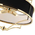 Lampa wisząca Stesso Gold Nero M, czarna z złotymi detalami, z czterema punktami świetlnymi. Widok z góry, ukazujący metalową konstrukcję i eleganckie wykończenie. Światło wydobywa się z przezroczystych kloszy.