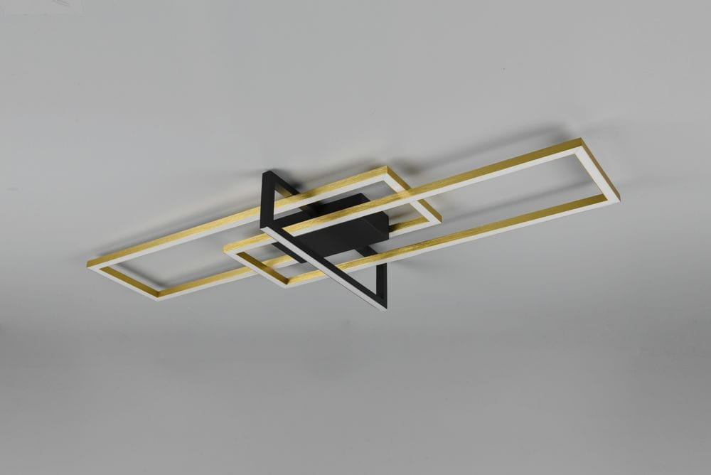 LED lampa sufitowa Salinas, 3-punktowa, z czarnym mocowaniem i geometrycznymi ramami w kolorze mosiądzu i bieli. Ujęcie z góry, montowana na suficie, z widocznymi prostokątnymi kształtami.