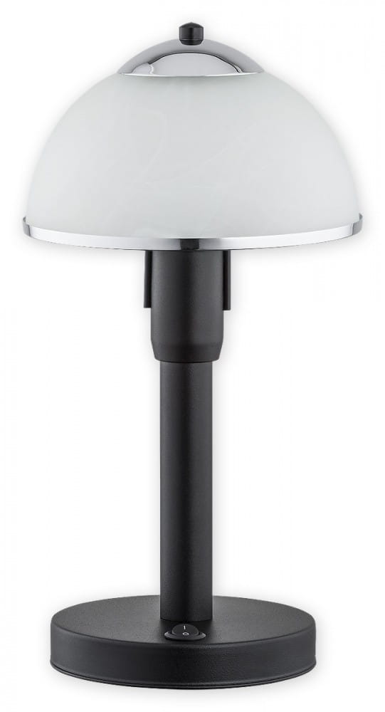 Lava lampa stołowa 1-punktowa w kolorze czarnym i chromowanym, z okrągłą podstawą i prostym, cylindrycznym słupkiem. Szklana klosz w kształcie półkuli w kolorze białym. Włącznik umieszczony na podstawie.