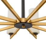 Lampa wisząca Fortano, 10-punktowa, w kolorze złotym z czarnymi akcentami. Widoczny centralny element z metalowego materiału oraz białe klosze w kształcie cylindrów. Ujęcie z dołu, ukazujące rozłożyste ramiona.