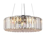 Lampa wisząca Recinto 6-punktowa MOD080CL-06CH, o okrągłym, przezroczystym kloszu z wyraźnymi, prostokątnymi żłobieniami, zawieszona na cienkich linkach. Efektowne odbicia świetlne, chromowany element mocujący. Idealna do nowoczesnych wnętrz.